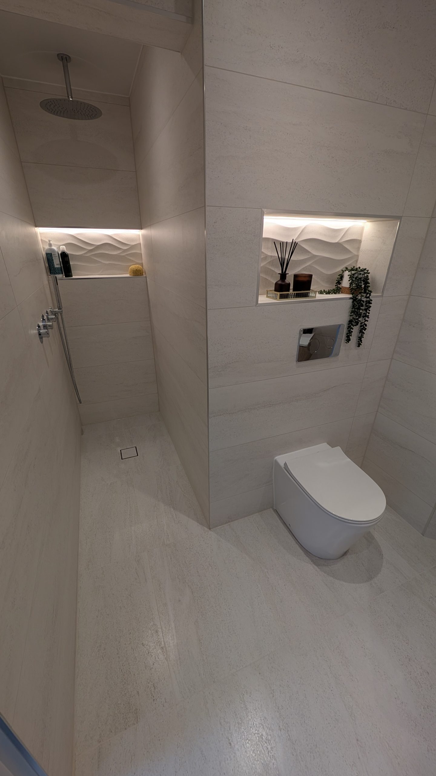 Home 1 Walk-in wet room with lit niches fitted by Clan Bathrooms