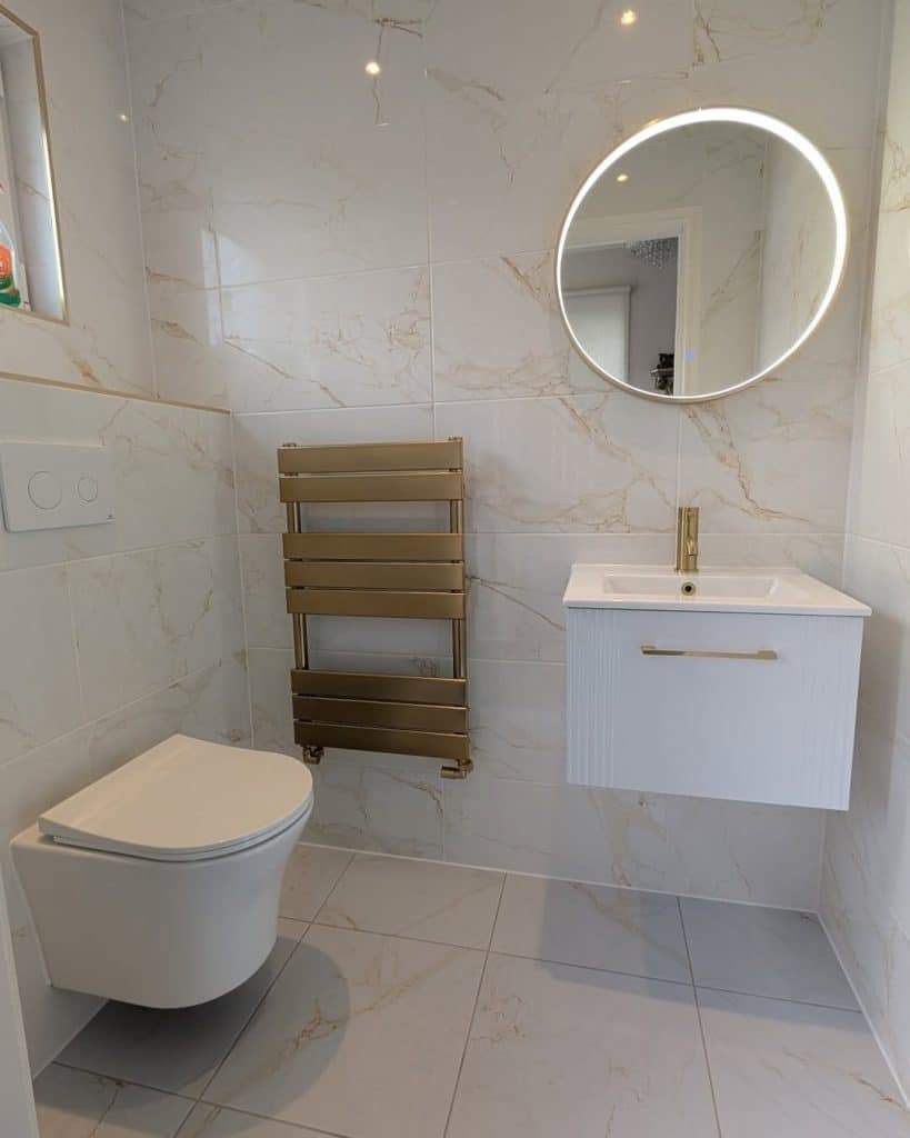 Bathroom Fitters in Dumbarton 4 Downstairs cloakroom in Dumbarton with wall-hung toilet, compact vanity, brass LED mirror and brass towel rail