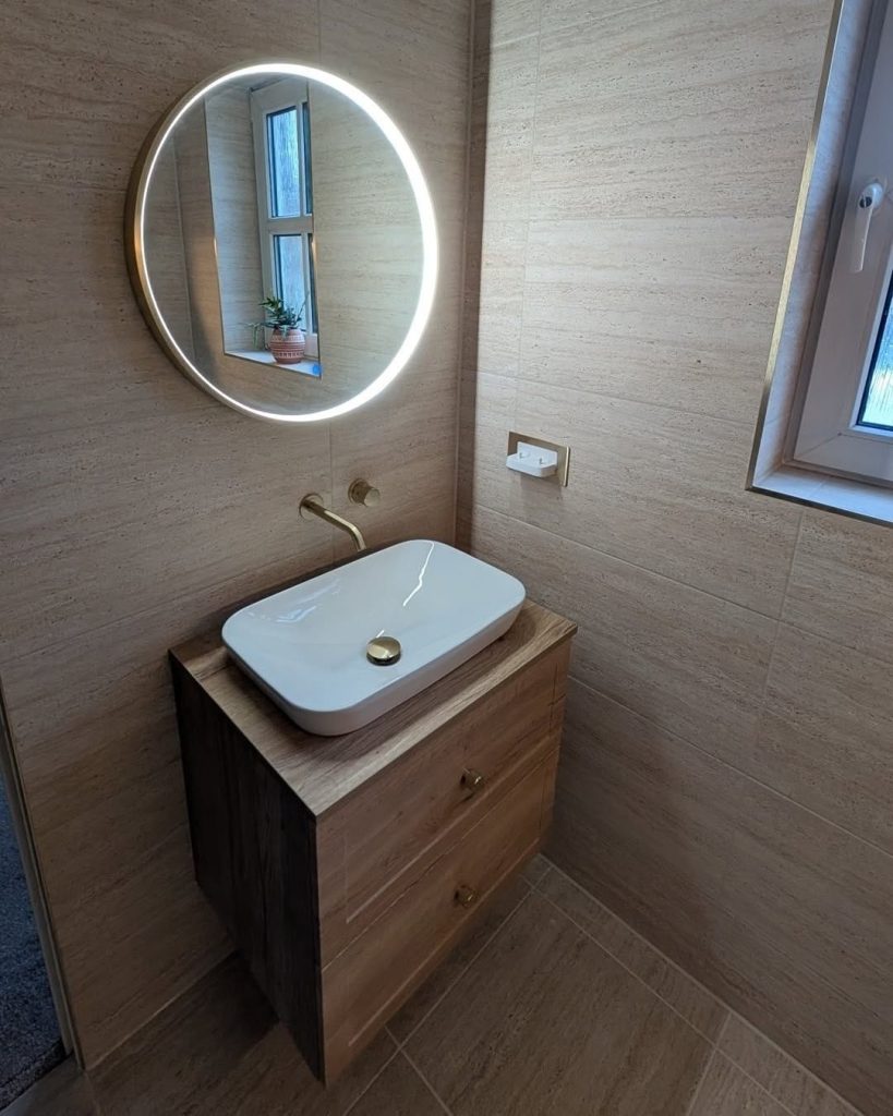 Bathroom Fitters in Paisley 3 Vessel basin on a wall-hung oak vanity with a round LED mirror in a Paisley en-suite
