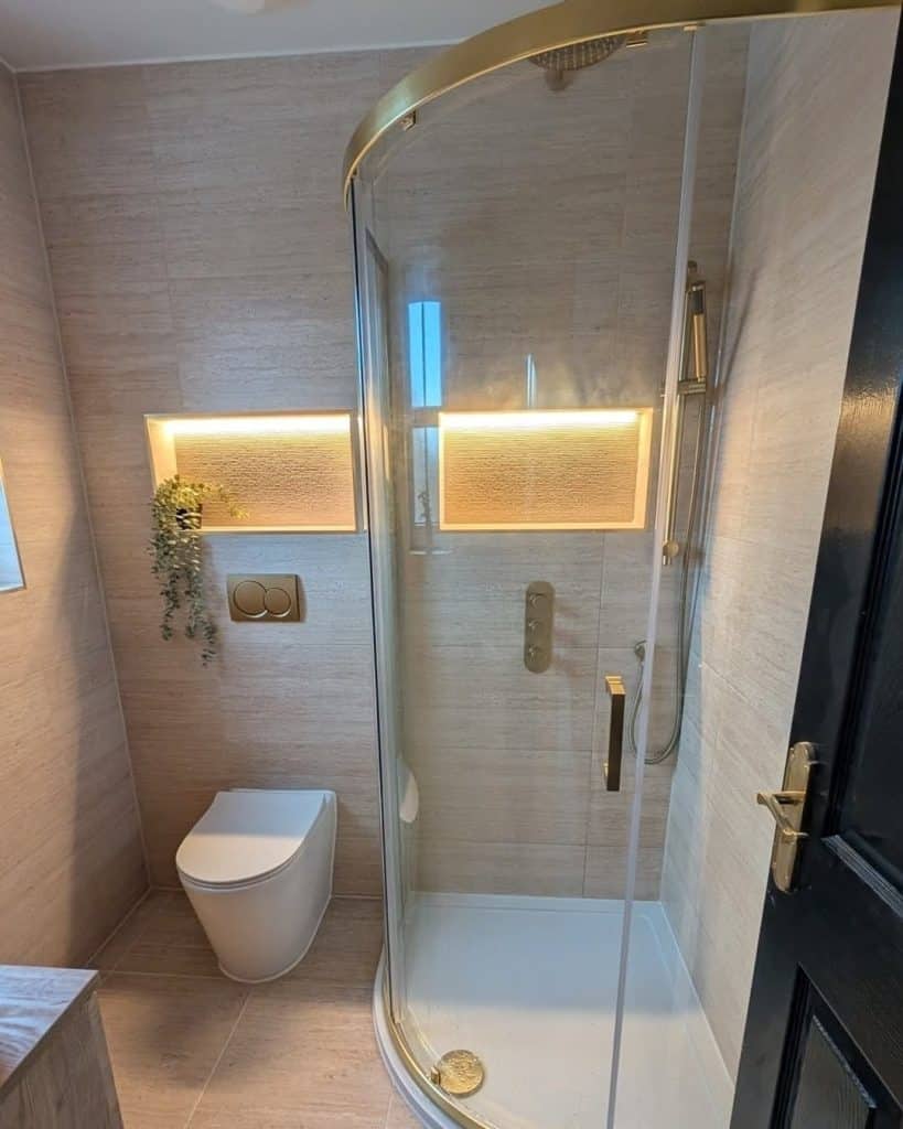 Bathroom Fitters in Paisley 1 En-suite in Paisley with quadrant shower, LED-lit niches, back-to-wall toilet and brushed brass fittings